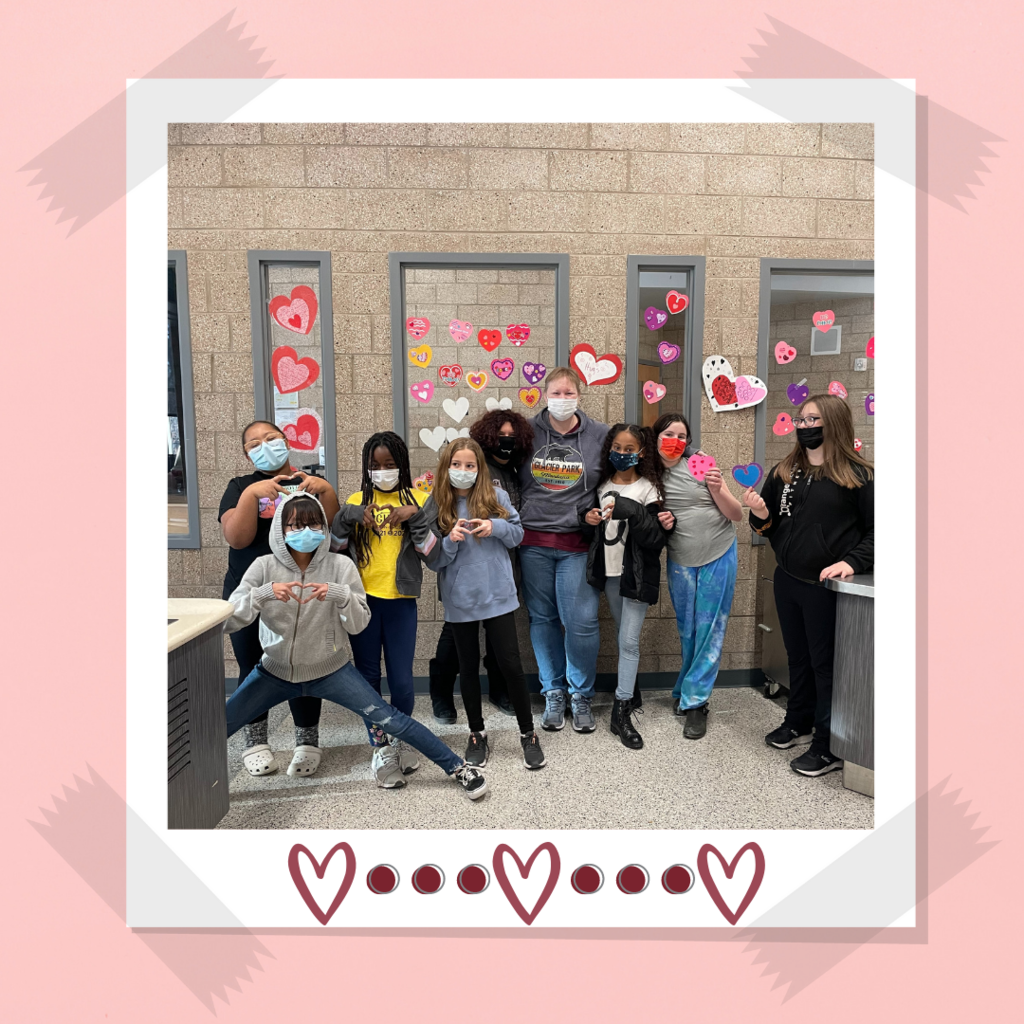 kromrey 5th grade students in front of the valentines decor they made for the lunchroom 